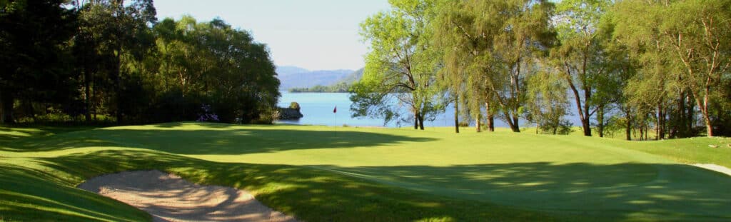 View across Killeen golf course showing manicured greens and distant hills.