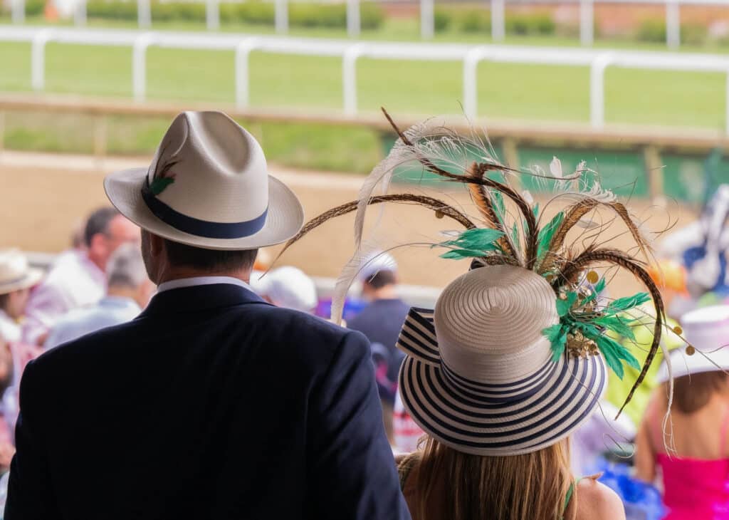 Elegant hats and fancy attire at the horse races